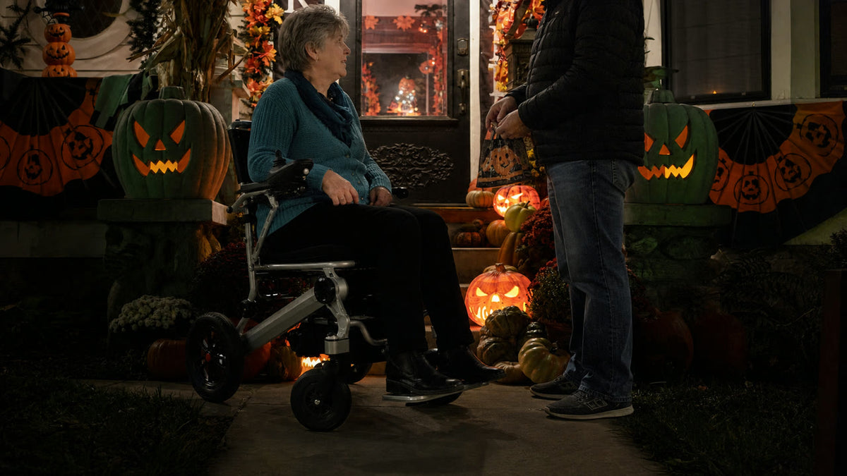 Fictional older adult using the Anywell YA12-5 on a modest Halloween community route; real-source-informed AI lifestyle scene